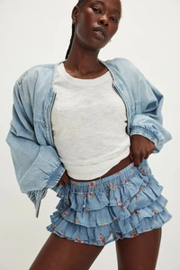 Detail of multi-layered floral tiered shorts with elastic waist for a summer look