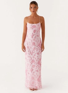 Close-up detail of light pink floral embroidery and sequins on backless long dress