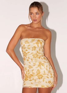 Detail of floral embroidery and sequins on a strapless beige mini party dress
