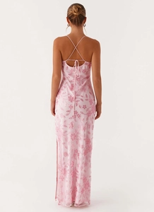 Detail of pink sequin embroidered dress showing back crisscross straps and bow tie