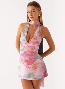 Detail of pink floral print mini dress with deep V-neckline and matching neck scarf