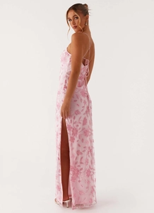 Detailed view of pink sequin floral embroidery and elegant high slit on a backless dress