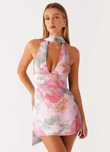 Floral halter mini dress featuring deep V-neck and matching fabric neck accessory