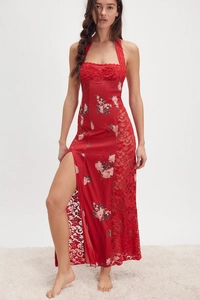Detail of red floral satin dress featuring halter neck and lace-up side split design