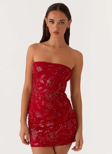 Detailed embroidery and sequins on a red strapless bodycon mini dress for parties