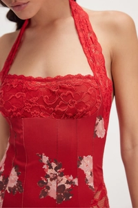 Detail of red floral lace bust and satin corsetry with vintage fishbone stitching