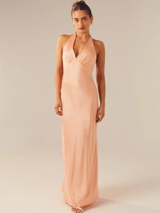 Elegant peach satin halter maxi dress with deep V-neck and open back for evening events