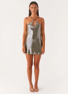 Detail of sequin mini dress featuring cross halter neck and teardrop cutout design