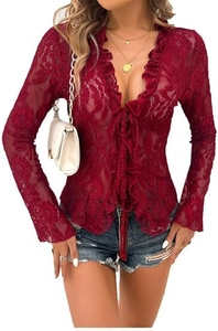 Detail of burgundy lace top with deep V-neck, ruffle trim, and front tie closure