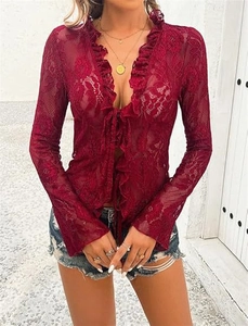 Detail of burgundy lace tie-front top with sheer floral mesh and ruffled edges
