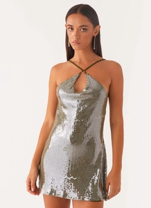 Detail of silver sequin dress with halter neck design and metal ring cutout