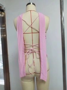 Detailed back view of pink sequin top featuring intricate cross-strap tie design