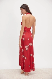 Detail of red floral satin maxi dress featuring backless cut and delicate lace trim