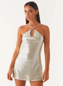 Detailed view of mint green sequin mini dress with halter neck and teardrop cutout