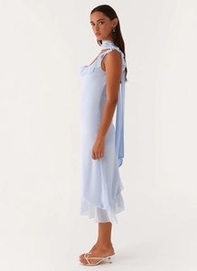 Close-up of light blue chiffon dress with ruffled neckline and elegant neck tie detail