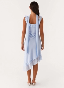 Rear view of a light blue chiffon dress with asymmetric hem and elegant flowing neck ties