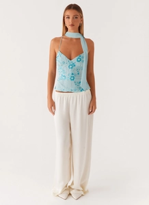 Close-up of light blue sequined camisole with floral embroidery and matching scarf