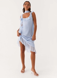 Detail of light blue chiffon dress with ruffled layers and matching neck strap
