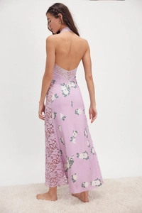 Detail of lavender floral halter maxi dress showing backless cut and lace stitching