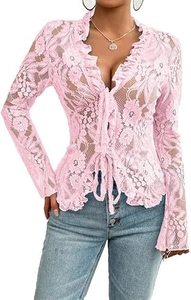 Detail of pink floral lace top with ruffled edges and front tie closure on mesh fabric