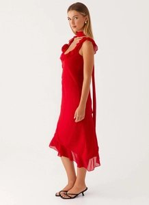 Detail of red chiffon dress with ruffled neckline and matching silk neck tie