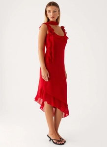 Detail of red chiffon dress featuring 3D floral shoulder decor and tiered ruffles