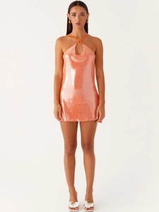 Sparkly coral sequin mini dress featuring a halter neck and chic teardrop cutout design