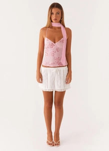 Pink floral embroidered camisole top with white eyelet mini skirt and matching scarf