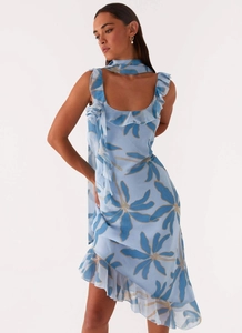 Detailed view of light blue chiffon floral dress with ruffles and asymmetrical hem