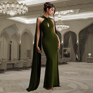 Detail of elegant dark green halter gown with neck cutout and floor-length cape veil