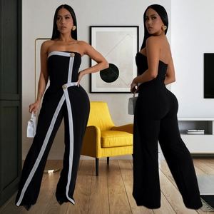 Women's chic strapless jumpsuit in black and white with gold buttons and wide legs