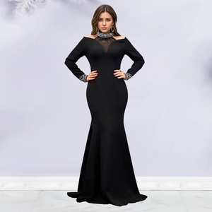 Detail of the elegant black evening dress with sheer mesh and sparkling rhinestones