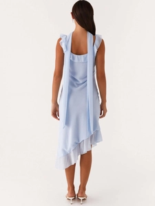 Light blue chiffon sleeveless dress featuring asymmetric hem and long back ribbons