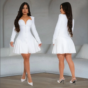 Close-up of elegant white V-neck mini dress with pleated hem and button details