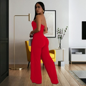 Detail of red strapless wide-leg jumpsuit with a button-up front and backless design