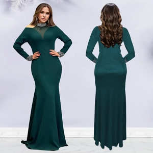 Close-up of elegant dark green evening dress with rhinestone beading on sheer neckline