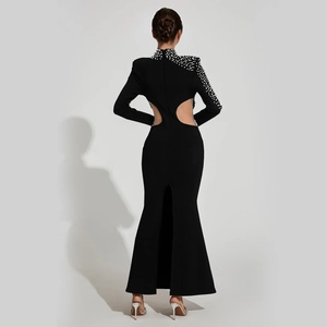 Elegant long sleeve black evening gown with pearl details and an open back design