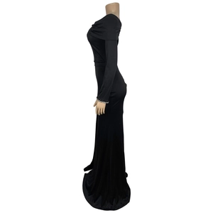 Detail of elegant black slim evening dress with rhinestone embellished sleeve cuffs