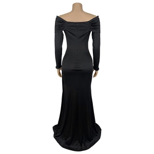Detail of elegant black off-shoulder evening gown with sequined cuffs and back zipper