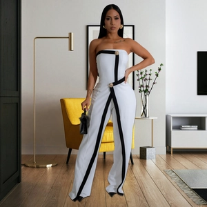 Chic white strapless wide-leg jumpsuit with black contrast outlines and gold buttons