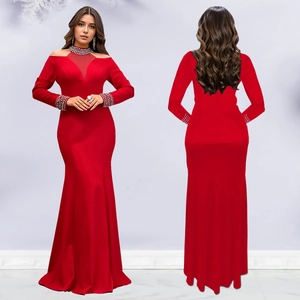 Detail of red slim fit evening dress featuring crystal embellishments and mesh neckline