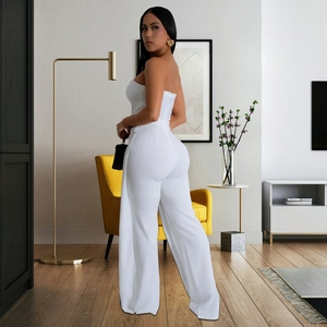 Detail of white tube top jumpsuit featuring an open back and hidden zipper design