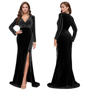 Detail view of black velvet evening dress with deep V-neck, sequins, and high side slit