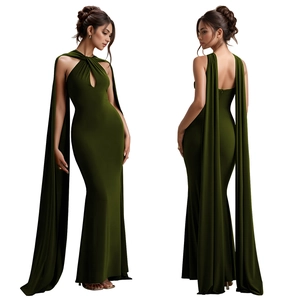 Detail of elegant dark green keyhole halter dress with long flowing cape and slim fit design