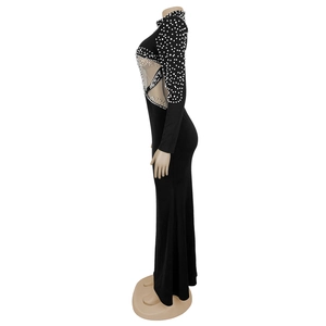 Detail of black long sleeve dress with white pearls and side mesh cutout panel