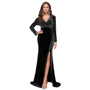 Detailed view of luxury black velvet dress with silver sequins, V-neck, and side slit