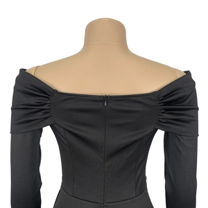 Detail of the elegant off-shoulder back with invisible zipper on the black evening dress
