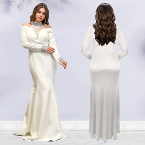 Detail of elegant white mermaid dress featuring rhinestone collar and sheer shoulder panels