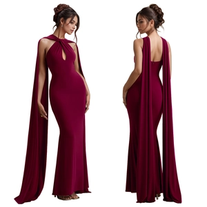 Detail view of burgundy halter neck maxi dress with elegant cape sleeves and hollow cut-out