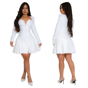 Detailed view of women's white dress featuring pleated skirt and single-breasted front